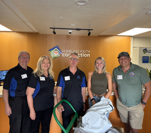 Elks volunteers delivering donations at the Homeless Youth Connection office